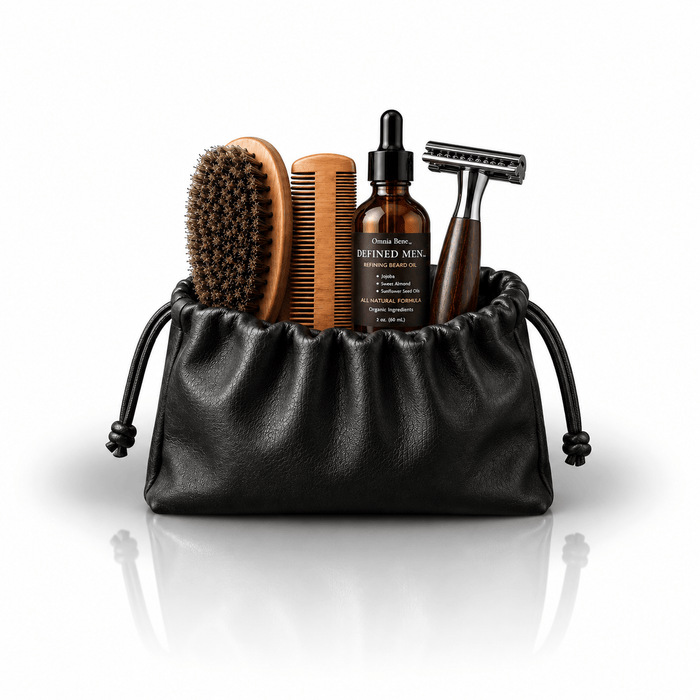 Omnia Bene Defined Men beard manicuring set: brush, comb, beard oil and razor with a black drawstring pouch. The Defined Men beard manicuring set in a black drawstring pouch - brush, comb, beard oil and razor. Everything needed to condition, shape and refine a beard, in one roll.