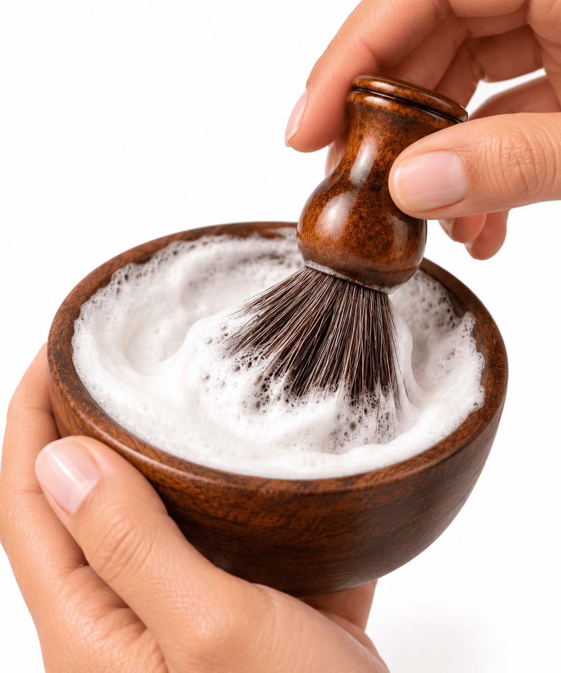 The Omnia Bene Heritage shave brush whipping shave cream into a rich lather in a wooden bowl.