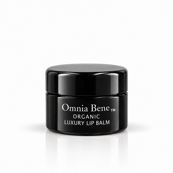 Omnia Bene Organic Luxury Lip Balm in a small black jar with white lettering. A small black jar of organic, vegan lip balm with white lettering. Botanical butters and oils, no petroleum. For dry, chapped lips - over the Vanilla Lip Scrub, or on its own.
