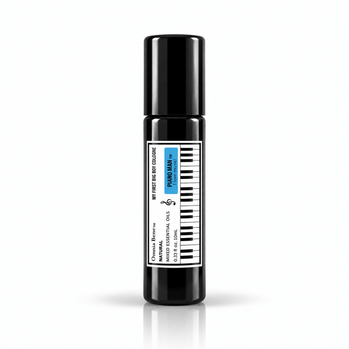 Omnia Bene Piano Man boys rollerball cologne, a 10 mL black roll-on with a piano-key label. A 10 mL black roll-on cologne with a piano-key label, made for boys. Alcohol free and gentle enough for young skin. Roll onto the wrists and the base of the neck.