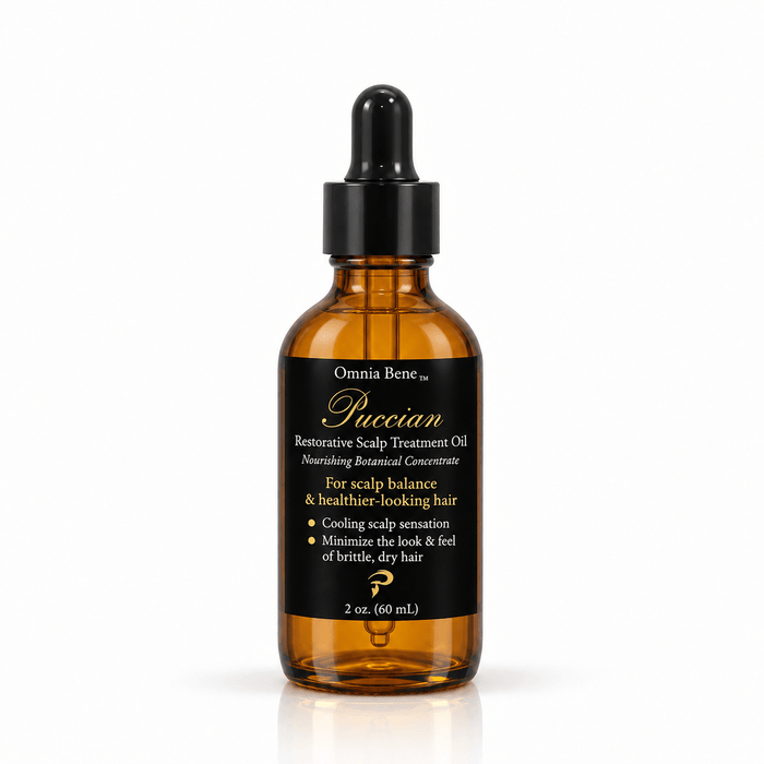 Omnia Bene Puccian Restorative Scalp Treatment Oil in a 2 oz amber glass dropper bottle. A 2 oz amber glass dropper bottle of Puccian restorative scalp treatment oil. For a dry, tight, flaking scalp and the hair that grows out of it. Part along the scalp, massage the oil in, leave it to work and wash it out.