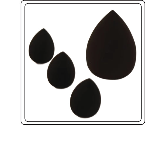 Black teardrop-shaped makeup sponges on a white background