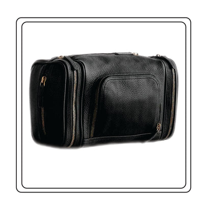 Black Nappa leather travel bag with gold zippers on a white background