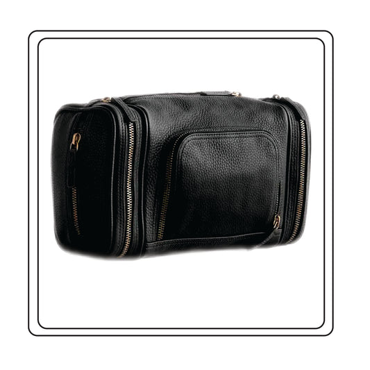 Black Nappa leather travel bag with gold zippers on a white background
