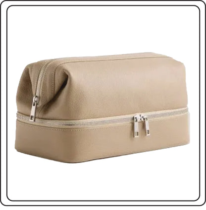 Beige leather toiletry, travel bag with a zipper on a white background