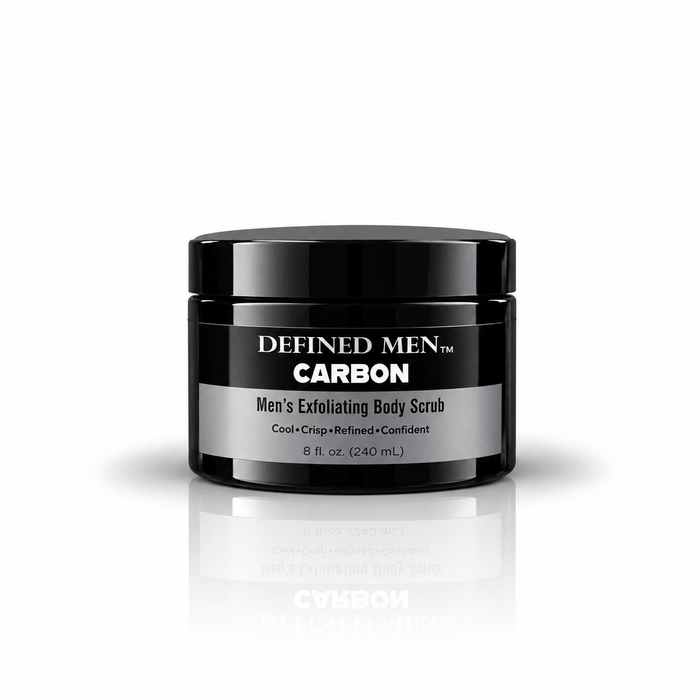 Omnia Bene Defined Men Carbon exfoliating body scrub for men in a black 8 fl oz jar. Sugar and mineral salts in organic butters and botanical oils. The Carbon scent is woodsy, citrusy and leather-like. For shoulders, back and anywhere skin is rough.