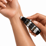 Omnia Bene Puccian KNOCKOUT sleep rollerball being rolled onto the inner wrist.