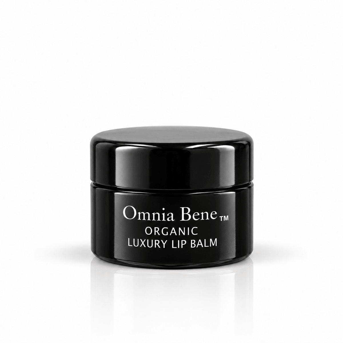 Omnia Bene Organic Luxury Lip Balm in a small black jar with white lettering. A small black jar of organic, vegan lip balm with white lettering. Botanical butters and oils, no petroleum. For dry, chapped lips - over the Vanilla Lip Scrub, or on its own.