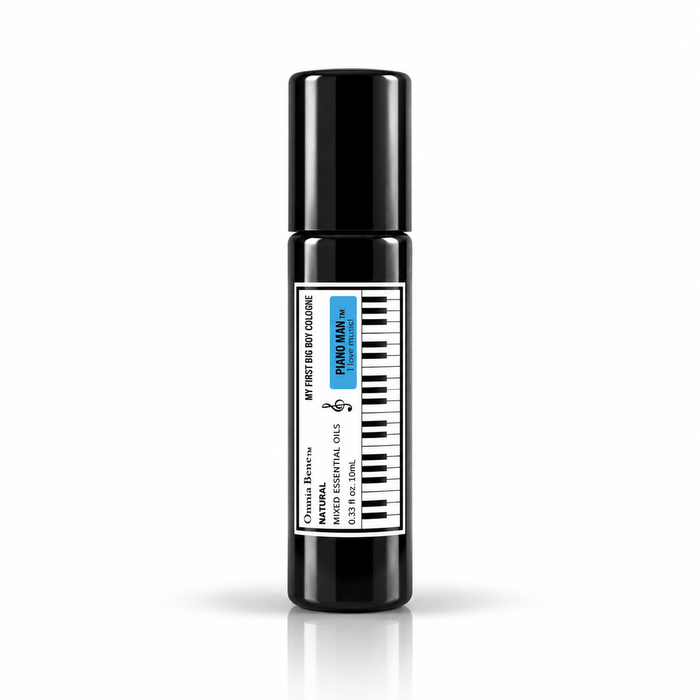 Omnia Bene Piano Man boys rollerball cologne, a 10 mL black roll-on with a piano-key label. A 10 mL black roll-on cologne with a piano-key label, made for boys. Alcohol free and gentle enough for young skin. Roll onto the wrists and the base of the neck.