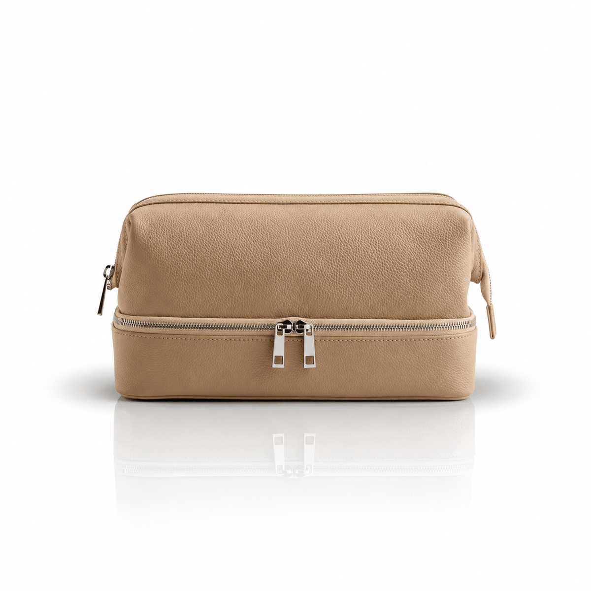Omnia Bene Puccian Italian leather travel case in tan with a double-zip lower compartment.