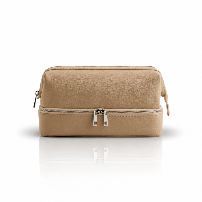 Omnia Bene Puccian Italian leather travel case in tan with a double-zip lower compartment.