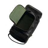 Omnia Bene Puccian Nappa leather dopp kit open to show its green canvas-lined interior.