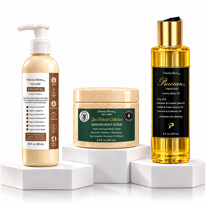 The Omnia Bene Radiance Set: Satin Lotion-Oil, AWAKEN Body Scrub and Puccian Liquid Gold body oil on white plinths. The three-step Radiance Set - AWAKEN Body Scrub to polish, Organic Satin Lotion-Oil to soften and Puccian Liquid Gold Body Oil to finish. Scrub first, then oil, then lotion-oil. Waterless organic butters and botanical oils throughout.