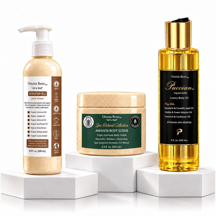 The Omnia Bene Radiance Set: Satin Lotion-Oil, AWAKEN Body Scrub and Puccian Liquid Gold body oil on white plinths. The three-step Radiance Set - AWAKEN Body Scrub to polish, Organic Satin Lotion-Oil to soften and Puccian Liquid Gold Body Oil to finish. Scrub first, then oil, then lotion-oil. Waterless organic butters and botanical oils throughout.
